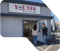 The Younik Auto Detailing Store front with customers walking in