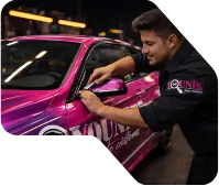 Technician Installing Car Wrap on Vehicle