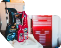 Professional Ceramic Coating Products on table in shop